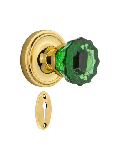 Classic Rosette Mortise Lock Set with Colored Fluted Crystal Glass Knobs Emerald in Un-Lacquered Brass.